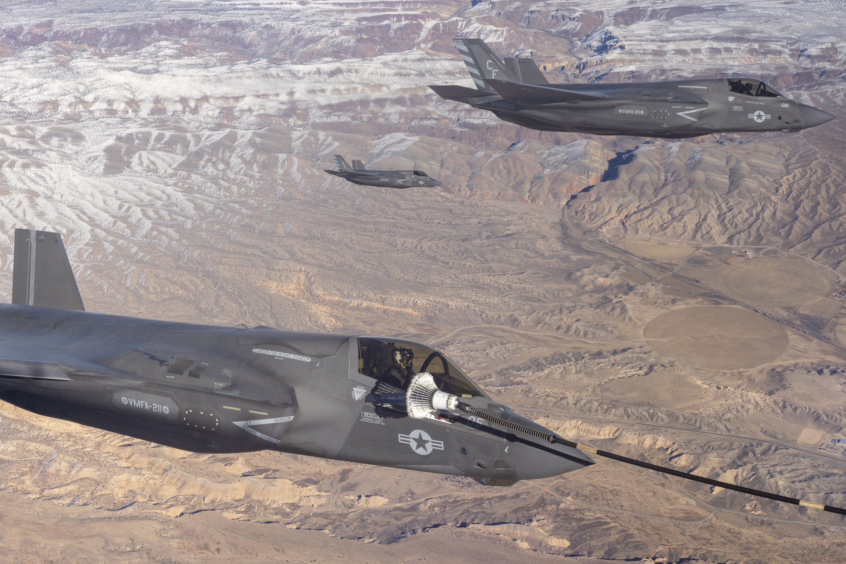 Image shows RAF Typhoon aircraft in flight during air to air refuelling.